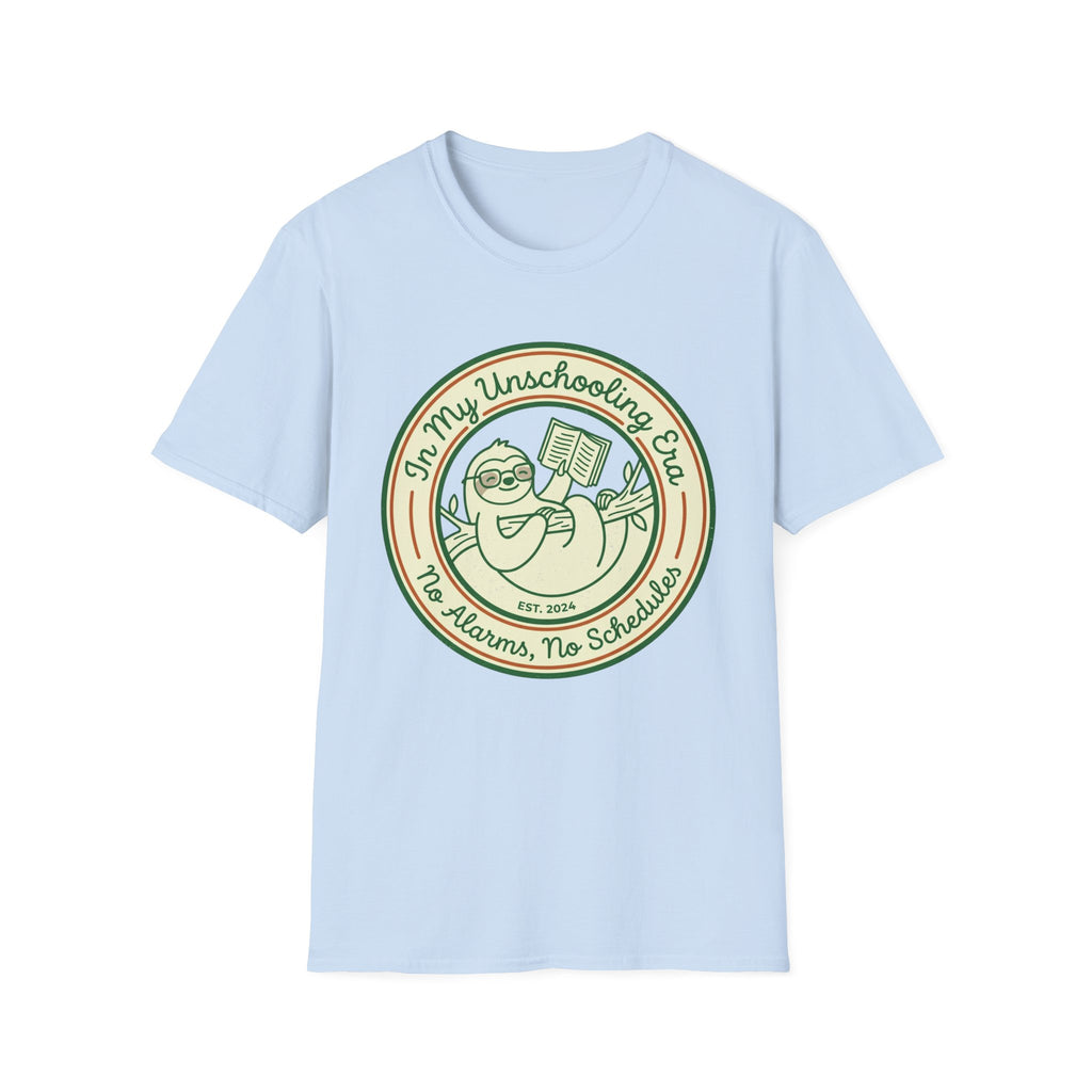 In My Unschooling Era homeschool mom graphic t-shirt with an adventurous homeschool graphic with nature, books, and outdoor learning energy