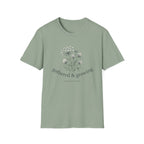Gathered & Growing homeschool mom graphic t-shirt with a gathered-at-home inspired graphic with books, florals, and cozy family learning details