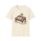The Work At Home Is Holy homeschool mom graphic t-shirt with a gathered-at-home inspired graphic with books, florals, and cozy family learning details