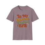 In My Charlotte Mason Era homeschool mom graphic t-shirt with a Charlotte Mason-inspired design with books, nature details, and vintage homeschool charm