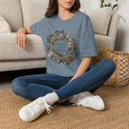 The World Is Our Classroom homeschool mom graphic t-shirt with an adventurous homeschool graphic with nature, books, and outdoor learning energy