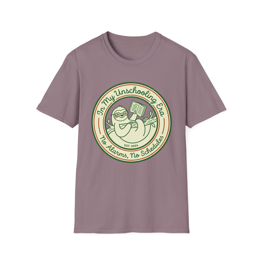 In My Unschooling Era homeschool mom graphic t-shirt with an adventurous homeschool graphic with nature, books, and outdoor learning energy