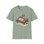 The Work At Home Is Holy homeschool mom graphic t-shirt with a gathered-at-home inspired graphic with books, florals, and cozy family learning details