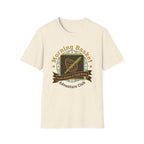 Morning Basket Adventure Club homeschool mom graphic t-shirt with a cozy morning basket-inspired design with books, gentle details, and home learning charm