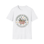 Gathered & Growing homeschool mom graphic t-shirt with a gathered-at-home inspired graphic with books, florals, and cozy family learning details