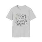 The Work At Home Is Holy homeschool mom graphic t-shirt with a gathered-at-home inspired graphic with books, florals, and cozy family learning details