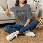 The Morning Basket homeschool mom graphic t-shirt with a cozy morning basket-inspired design with books, gentle details, and home learning charm
