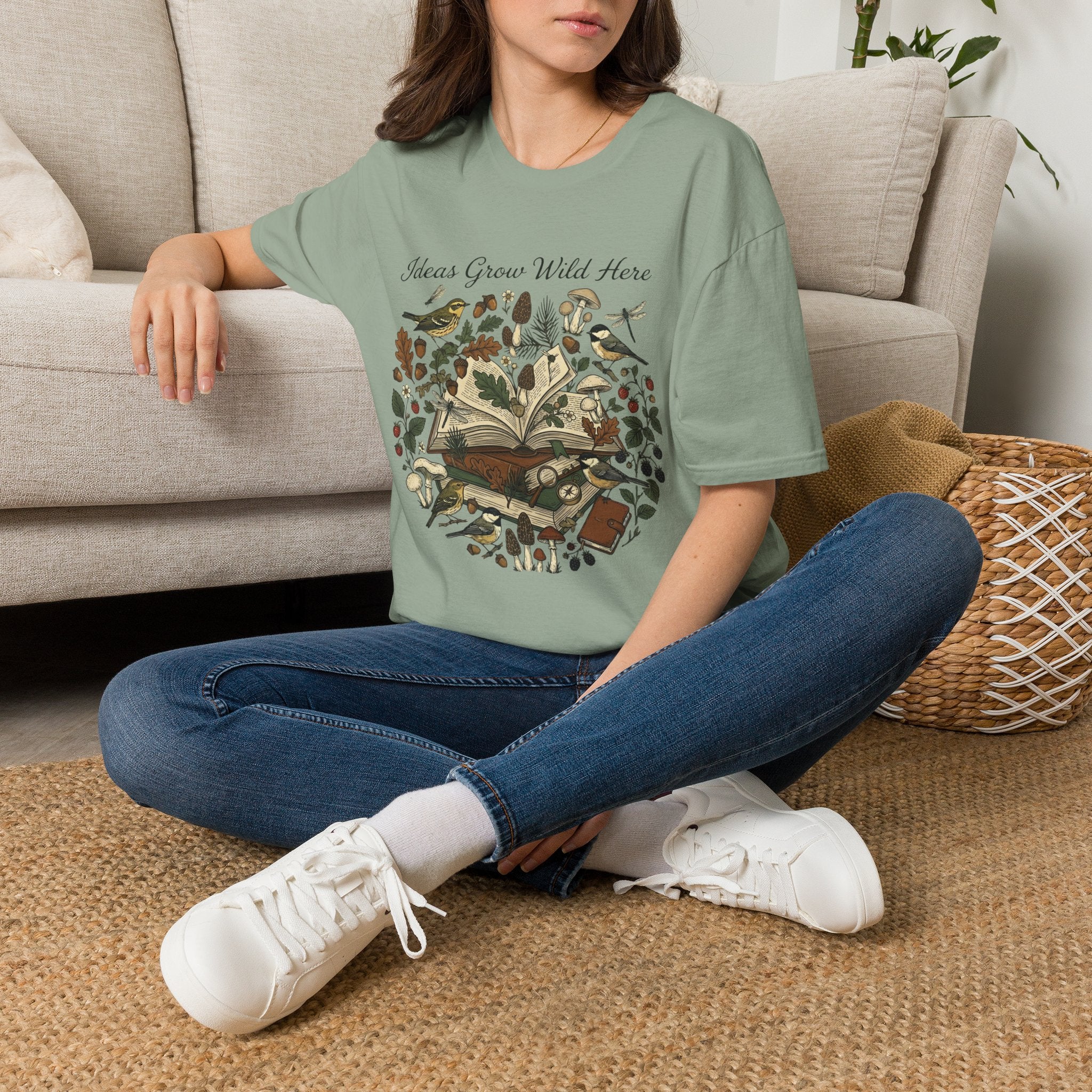 Ideas Grow Wild Here homeschool mom graphic t-shirt with an adventurous homeschool graphic with nature, books, and outdoor learning energy