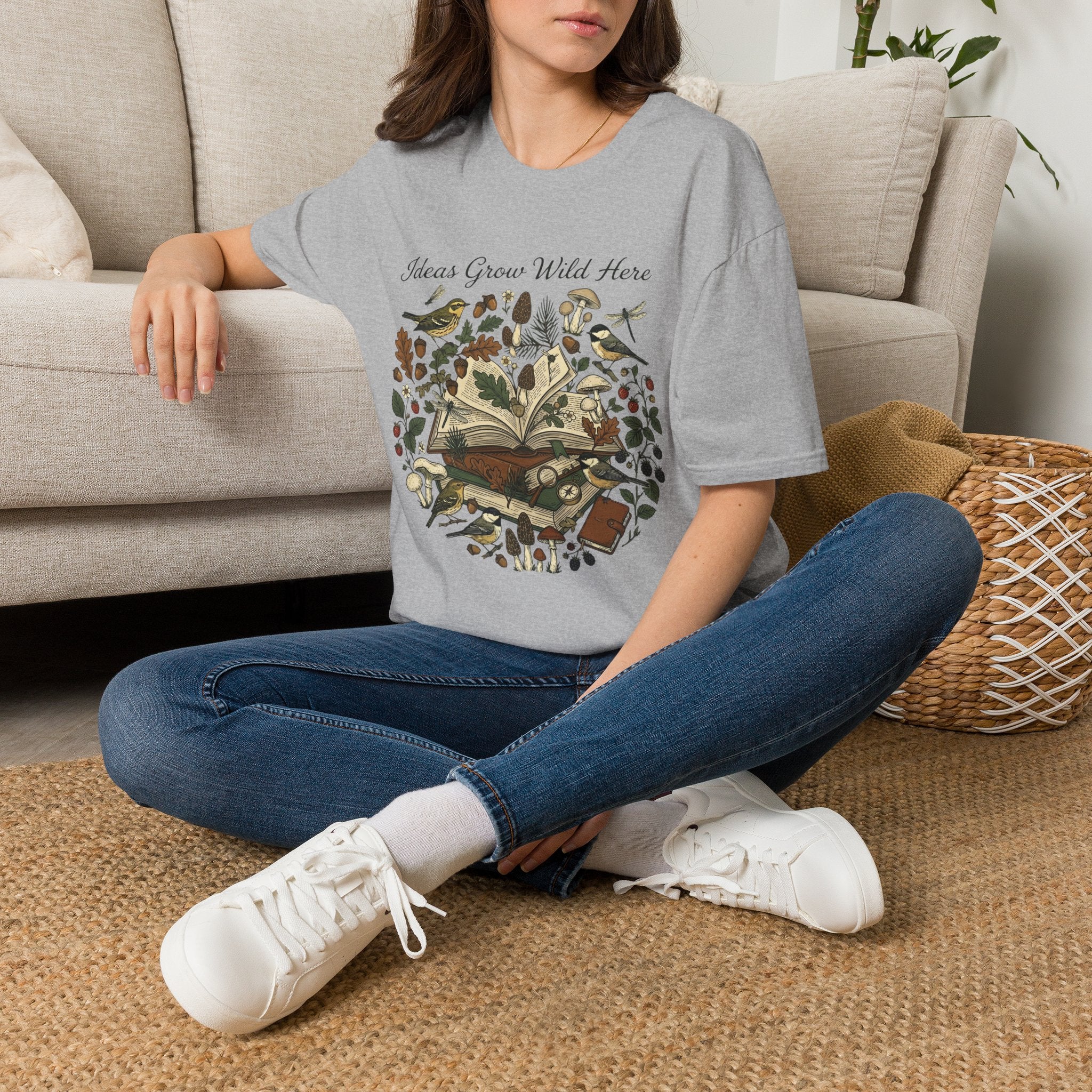Ideas Grow Wild Here homeschool mom graphic t-shirt with an adventurous homeschool graphic with nature, books, and outdoor learning energy