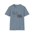 Gathered And Growing homeschool mom graphic t-shirt with a gathered-at-home inspired graphic with books, florals, and cozy family learning details