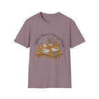 Gather Them In Beauty homeschool mom graphic t-shirt with a gathered-at-home inspired graphic with books, florals, and cozy family learning details