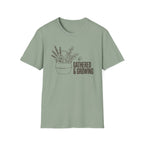 Gathered And Growing homeschool mom graphic t-shirt with a gathered-at-home inspired graphic with books, florals, and cozy family learning details