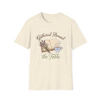 Gathered Around The Table homeschool mom graphic t-shirt with a gathered-at-home inspired graphic with books, florals, and cozy family learning details