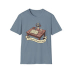 The Work At Home Is Holy homeschool mom graphic t-shirt with a gathered-at-home inspired graphic with books, florals, and cozy family learning details