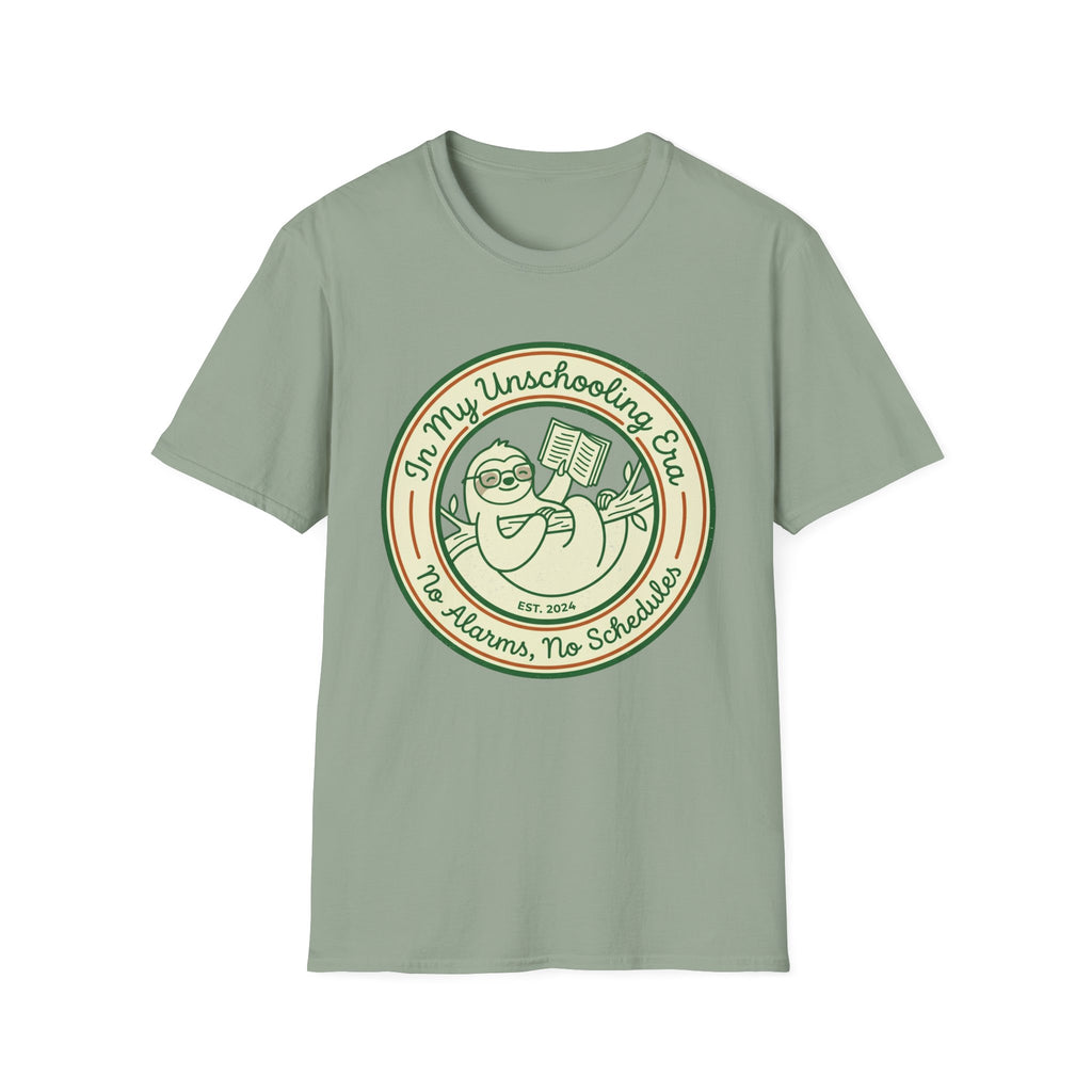 In My Unschooling Era homeschool mom graphic t-shirt with an adventurous homeschool graphic with nature, books, and outdoor learning energy
