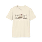 Gather Round The Morning Basket homeschool mom graphic t-shirt with a gathered-at-home inspired graphic with books, florals, and cozy family learning details