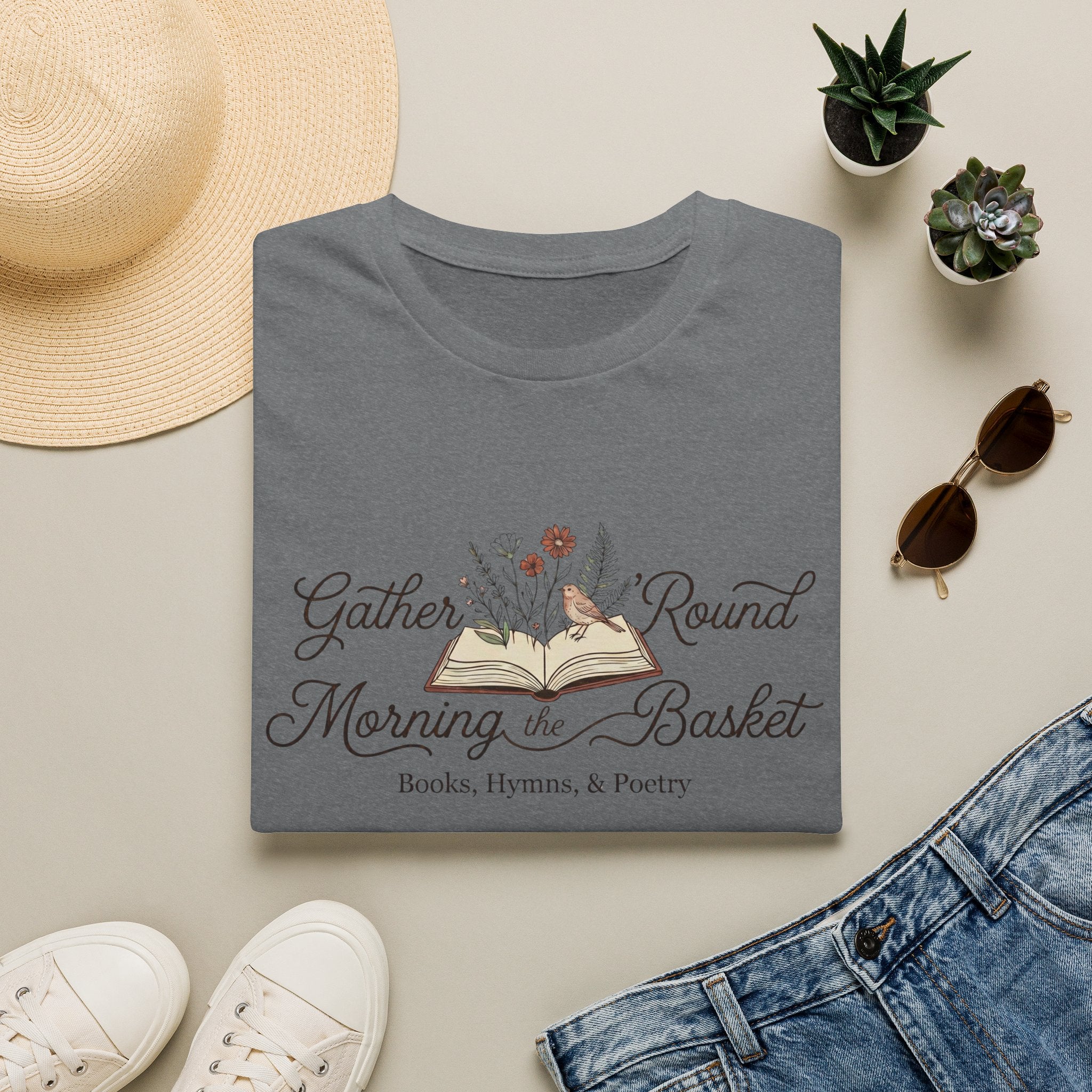 Gather Round The Morning Basket homeschool mom graphic t-shirt with a gathered-at-home inspired graphic with books, florals, and cozy family learning details