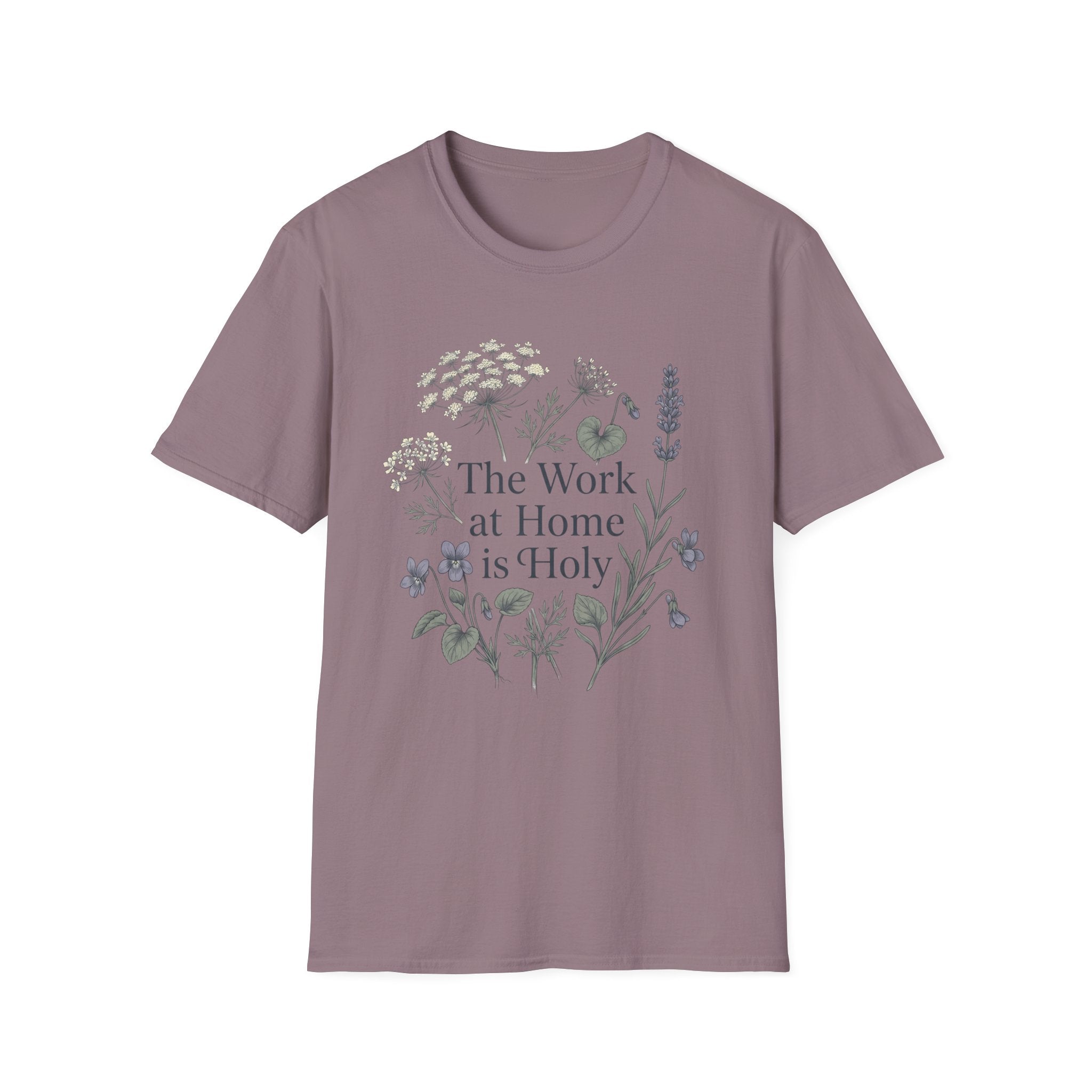 The Work At Home Is Holy homeschool mom graphic t-shirt with a gathered-at-home inspired graphic with books, florals, and cozy family learning details