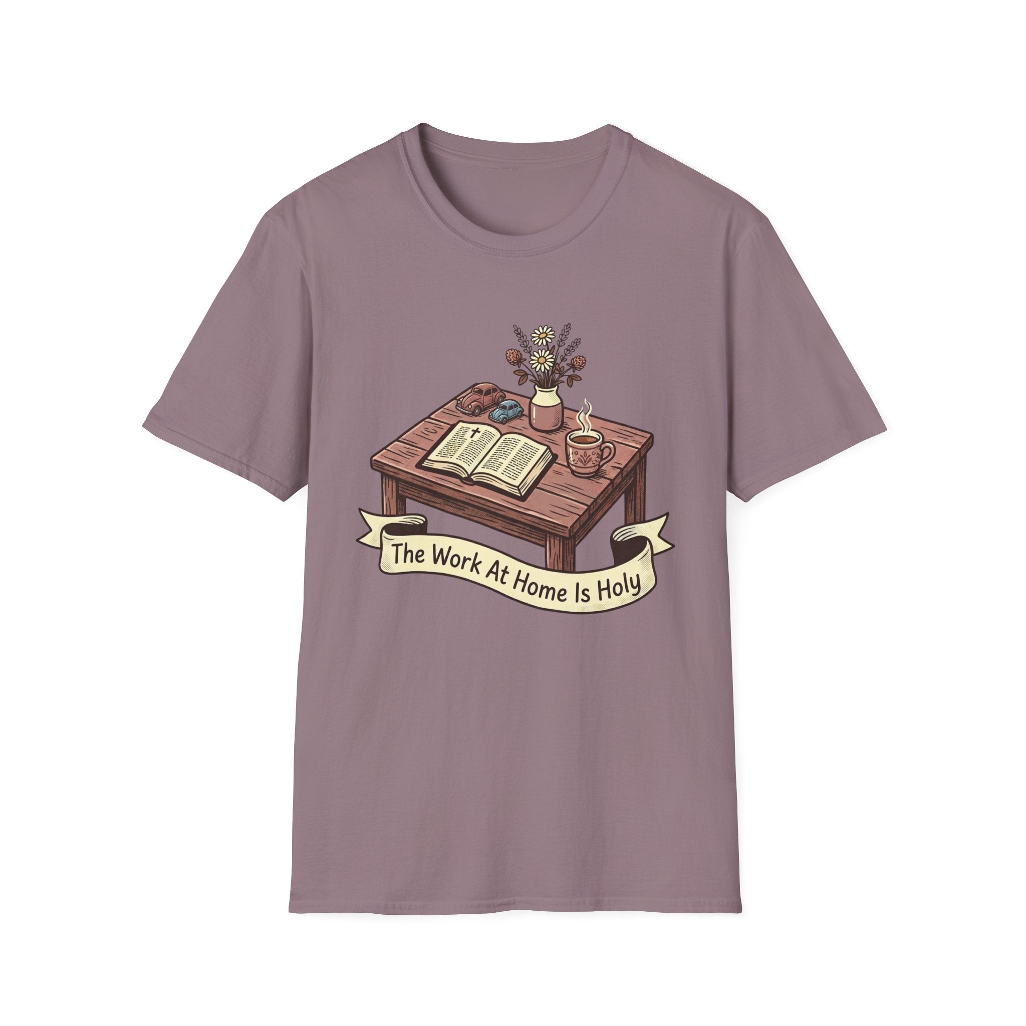 The Work At Home Is Holy homeschool mom graphic t-shirt with a gathered-at-home inspired graphic with books, florals, and cozy family learning details