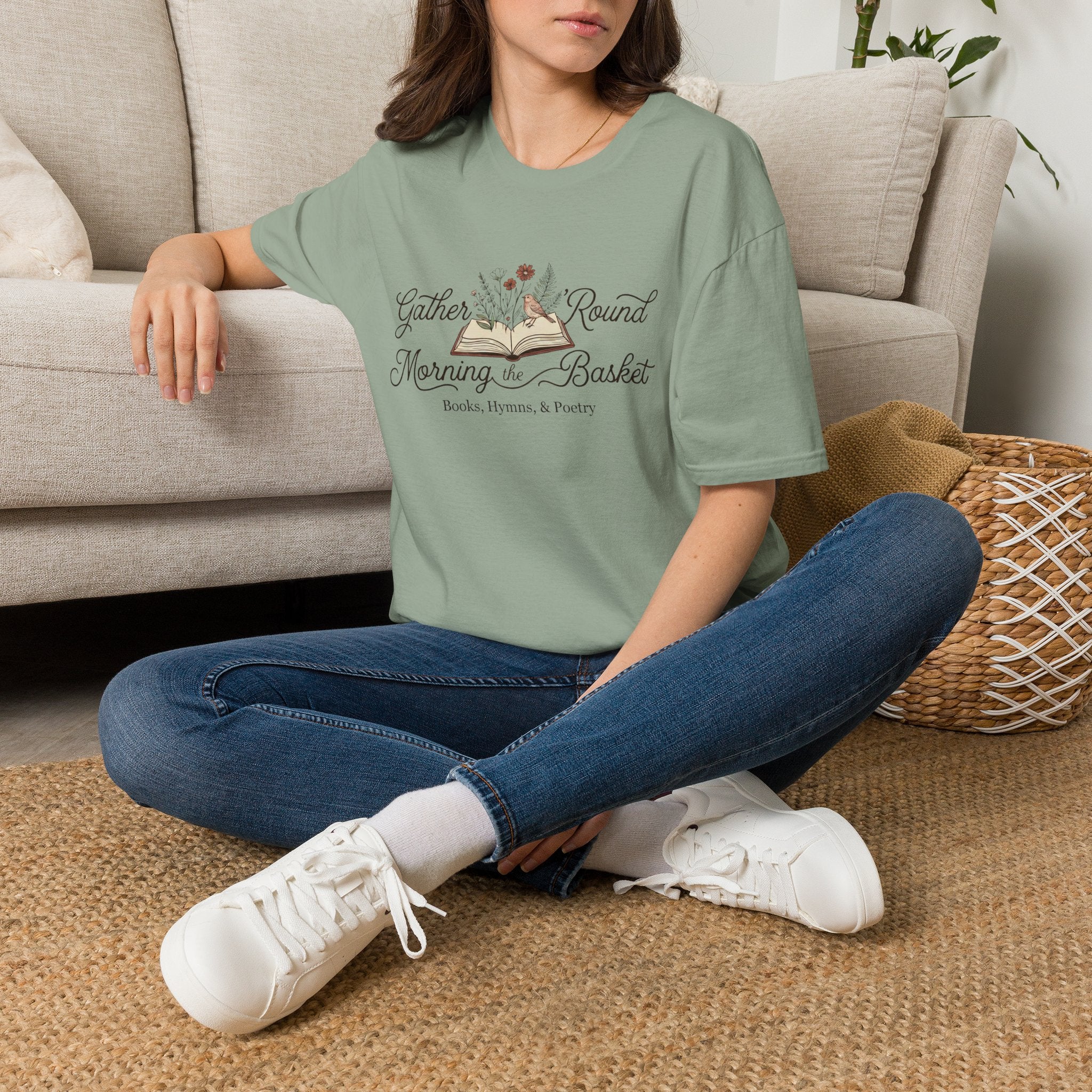 Gather Round The Morning Basket homeschool mom graphic t-shirt with a gathered-at-home inspired graphic with books, florals, and cozy family learning details