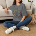 The World Is Our Classroom homeschool mom graphic t-shirt with an adventurous homeschool graphic with nature, books, and outdoor learning energy