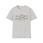 Gather Round The Morning Basket homeschool mom graphic t-shirt with a gathered-at-home inspired graphic with books, florals, and cozy family learning details