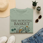 The Morning Basket homeschool mom graphic t-shirt with a cozy morning basket-inspired design with books, gentle details, and home learning charm