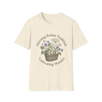 Morning Basket Tradition homeschool mom graphic t-shirt with a cozy morning basket-inspired design with books, gentle details, and home learning charm