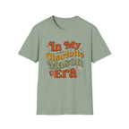 In My Charlotte Mason Era homeschool mom graphic t-shirt with a Charlotte Mason-inspired design with books, nature details, and vintage homeschool charm