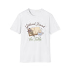 Gathered Around The Table homeschool mom graphic t-shirt with a gathered-at-home inspired graphic with books, florals, and cozy family learning details