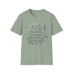 The Work At Home Is Holy homeschool mom graphic t-shirt with a gathered-at-home inspired graphic with books, florals, and cozy family learning details