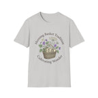 Morning Basket Tradition homeschool mom graphic t-shirt with a cozy morning basket-inspired design with books, gentle details, and home learning charm