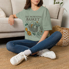 The Morning Basket homeschool mom graphic t-shirt with a cozy morning basket-inspired design with books, gentle details, and home learning charm