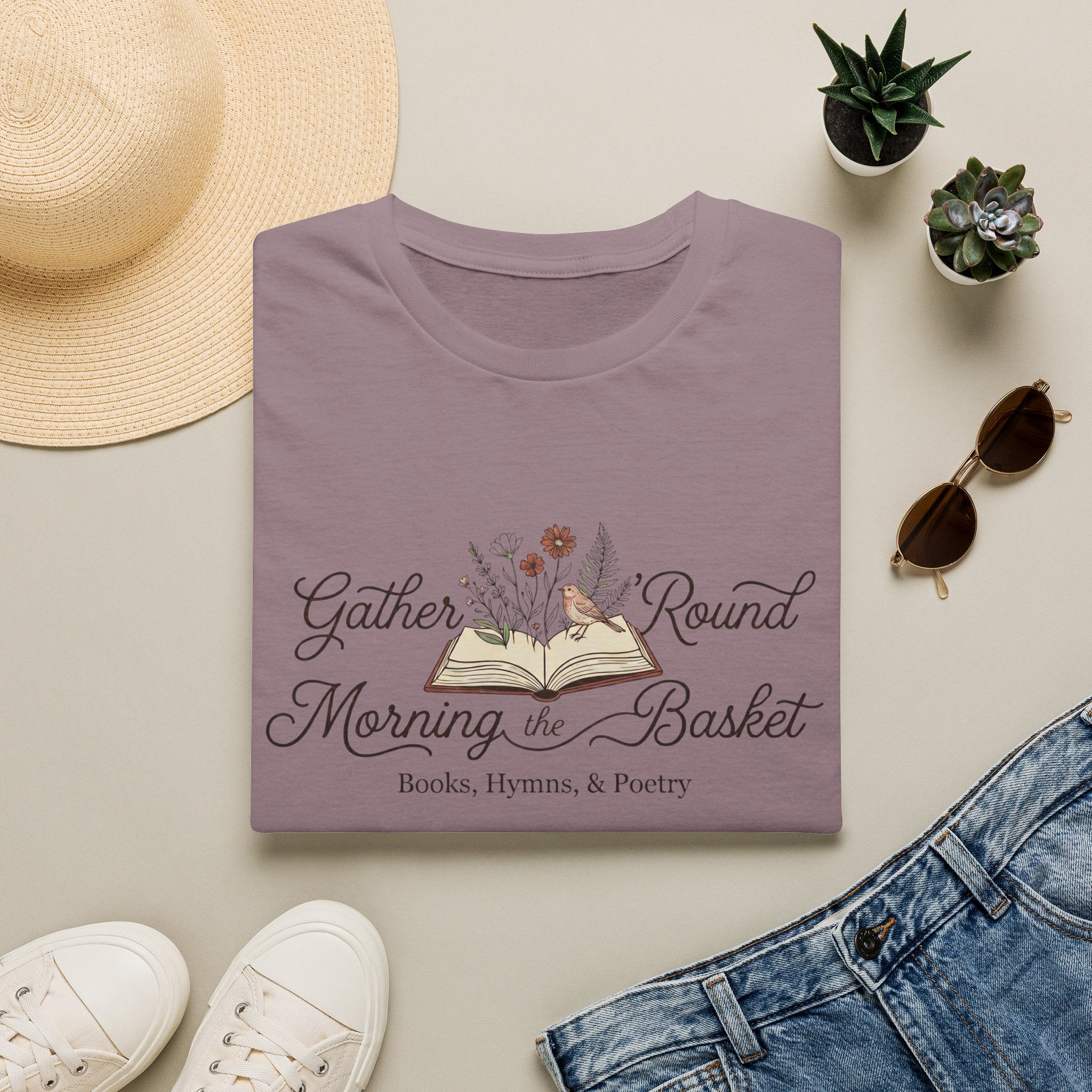 Gather Round The Morning Basket homeschool mom graphic t-shirt with a gathered-at-home inspired graphic with books, florals, and cozy family learning details