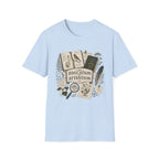The Education Of Attention homeschool mom graphic t-shirt with a Charlotte Mason-inspired design with books, nature details, and vintage homeschool charm