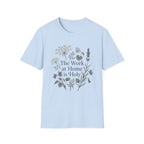 The Work At Home Is Holy homeschool mom graphic t-shirt with a gathered-at-home inspired graphic with books, florals, and cozy family learning details