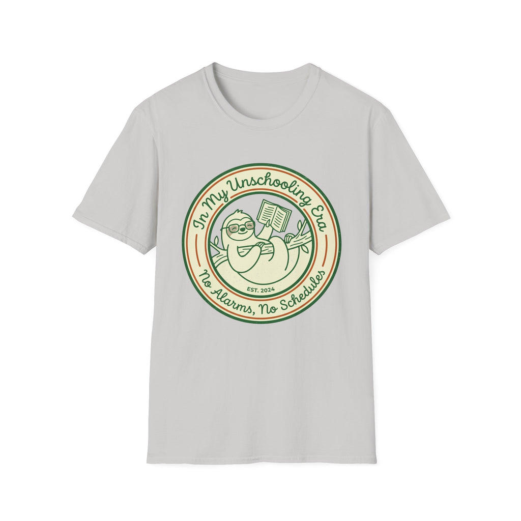 In My Unschooling Era homeschool mom graphic t-shirt with an adventurous homeschool graphic with nature, books, and outdoor learning energy