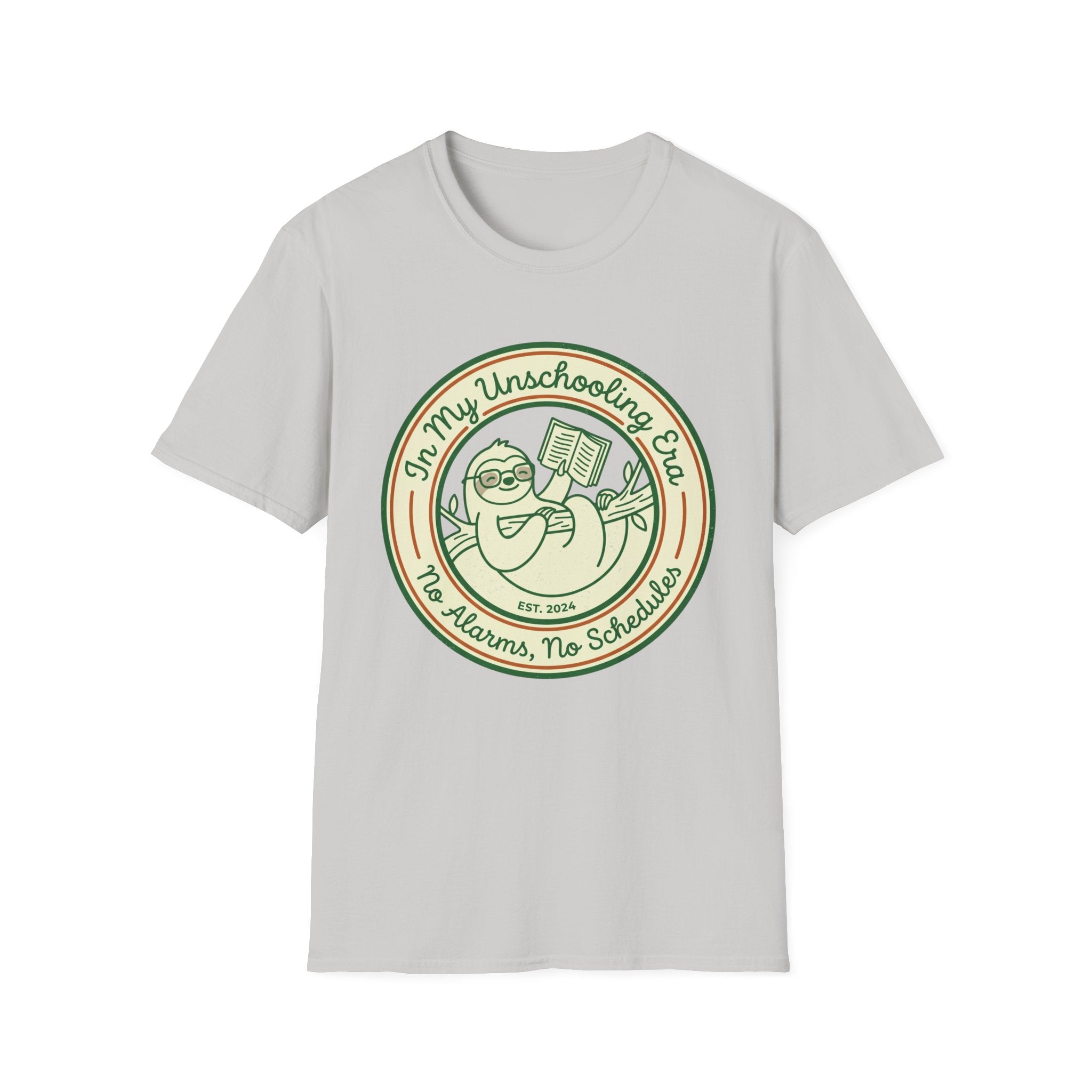 In My Unschooling Era homeschool mom graphic t-shirt with an adventurous homeschool graphic with nature, books, and outdoor learning energy