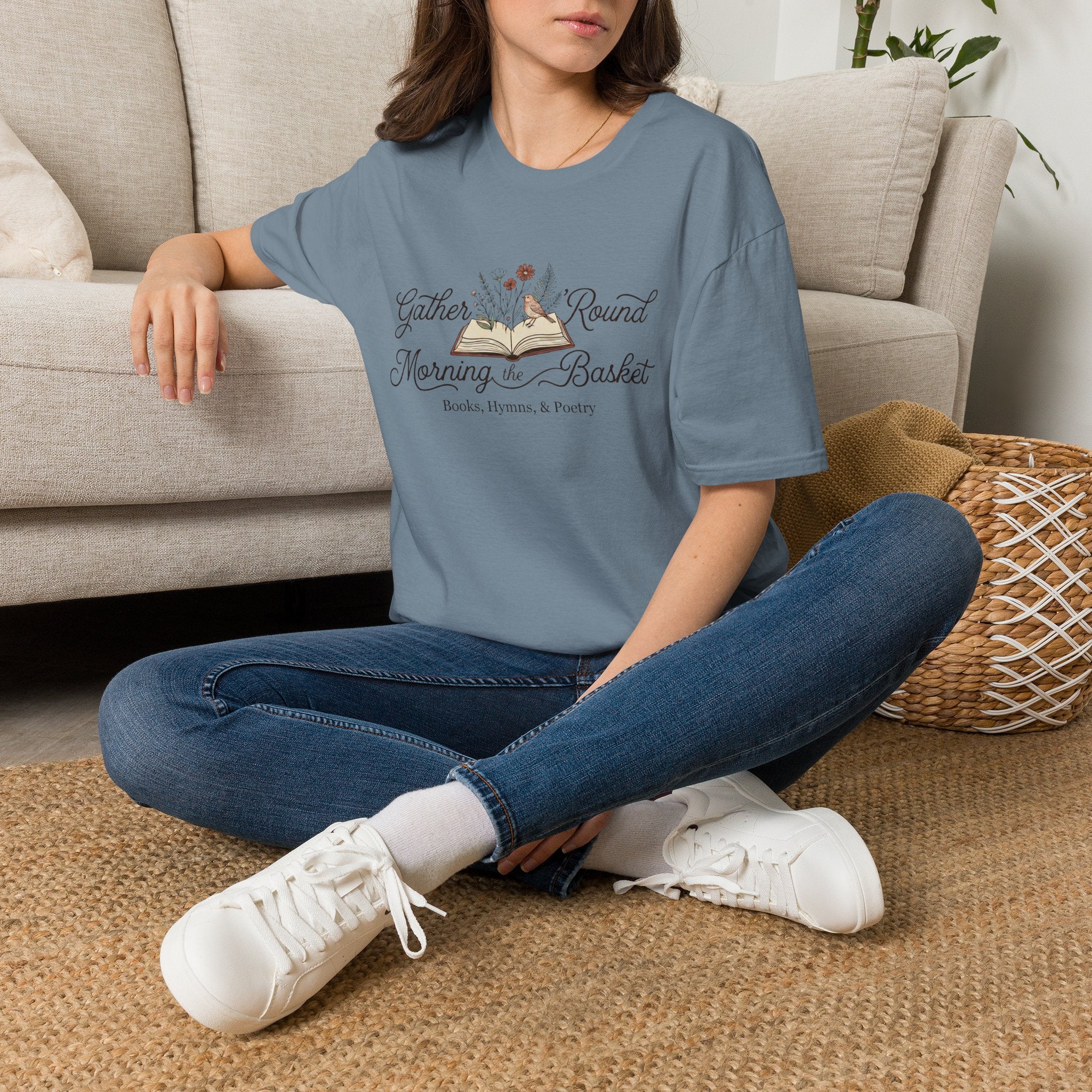 Gather Round The Morning Basket homeschool mom graphic t-shirt with a gathered-at-home inspired graphic with books, florals, and cozy family learning details
