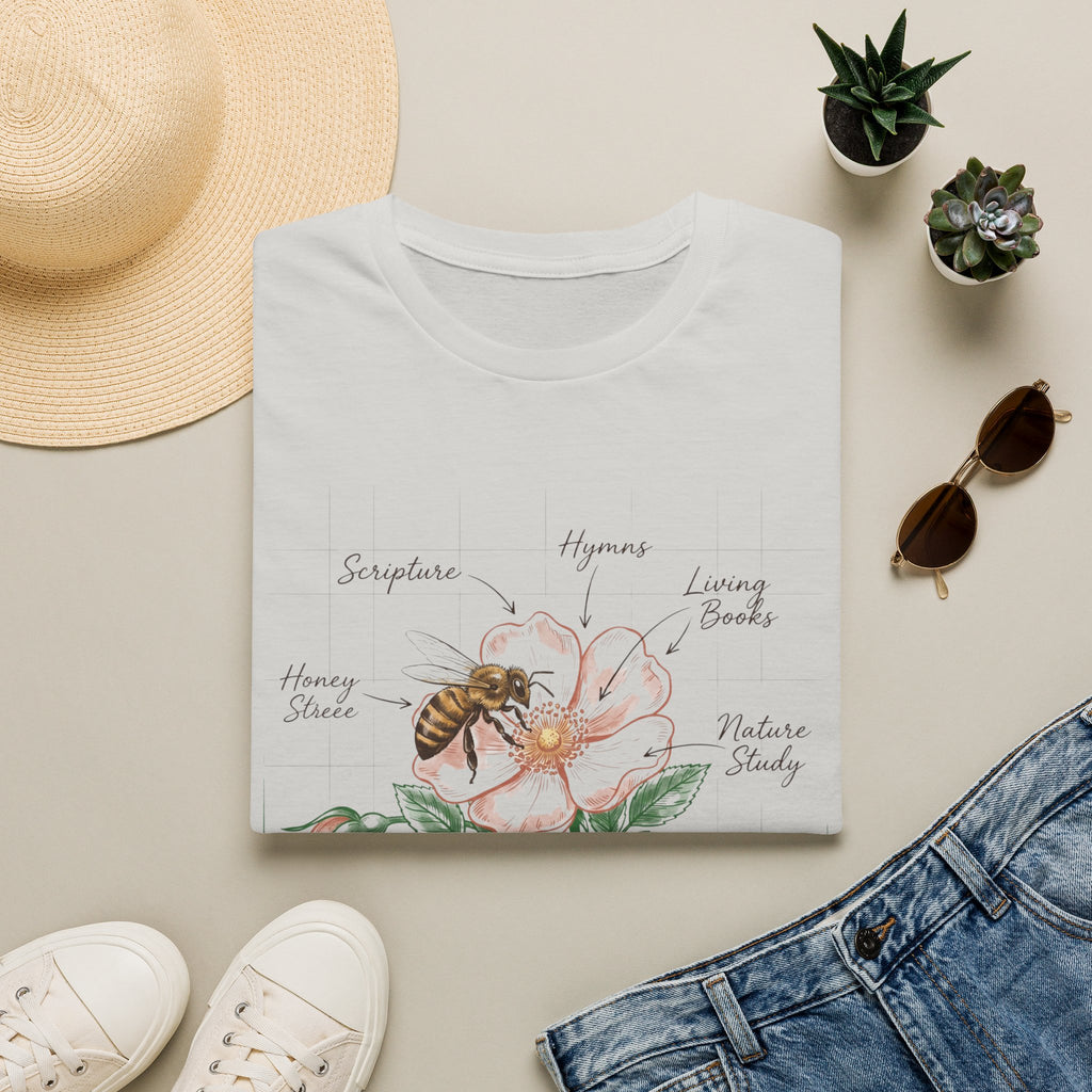 Mason Mother homeschool mom graphic t-shirt with a Charlotte Mason-inspired design with books, nature details, and vintage homeschool charm
