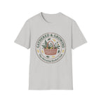 Gathered & Growing homeschool mom graphic t-shirt with a gathered-at-home inspired graphic with books, florals, and cozy family learning details