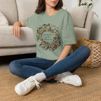 The World Is Our Classroom homeschool mom graphic t-shirt with an adventurous homeschool graphic with nature, books, and outdoor learning energy